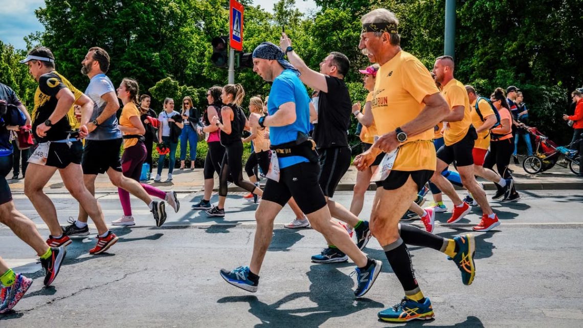 Runners participate in the lively Poznań Marathon in Poland.